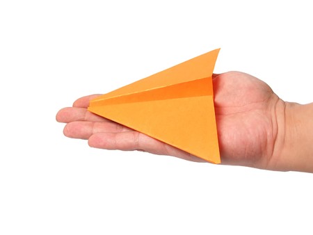 Origami airplane in hand