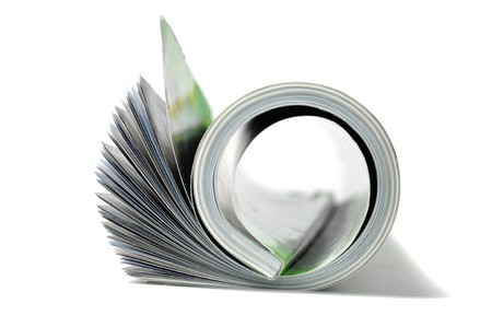 Roll of magazine isolated on white background の写真素材