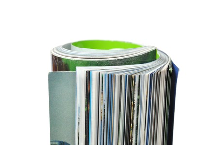 Roll of magazine isolated on white background の写真素材