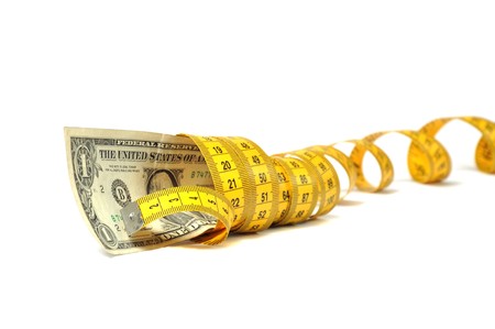 Dollar banknote and measure tapeの写真素材