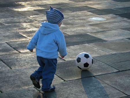 Little child playing soccer ballの写真素材