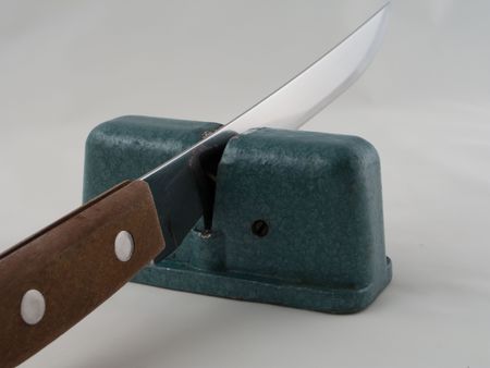 Steel knife sharpener isolated on whiteの写真素材