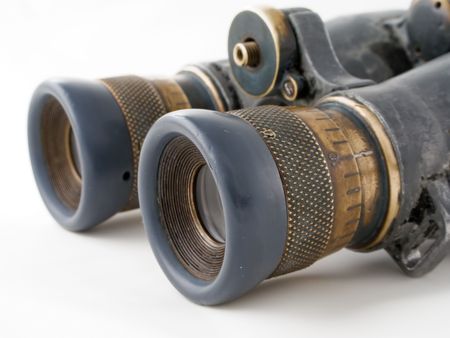 Looking binoculars lens isolated on white conceptsの写真素材