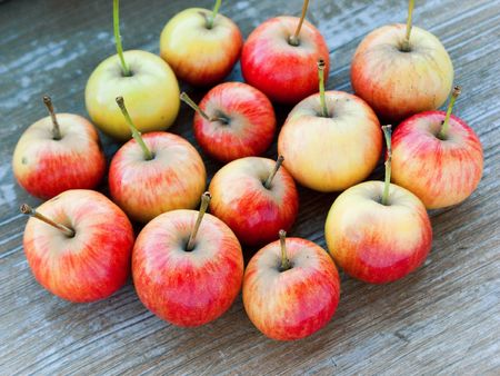 Healthy eating apple fruit food isolated on woodの写真素材