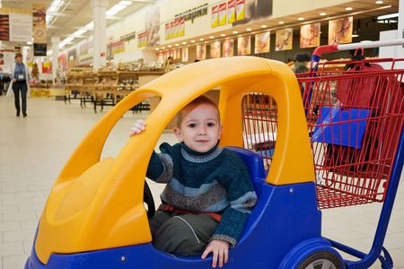 Supermarket store little child shopping cart carの写真素材
