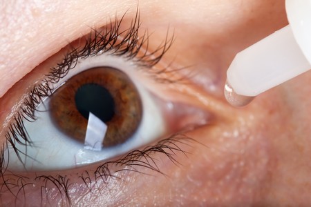 Medicine healthcare liquid eyedropper on human eyeの写真素材