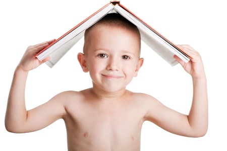 Human child holding on head education reading bookの写真素材