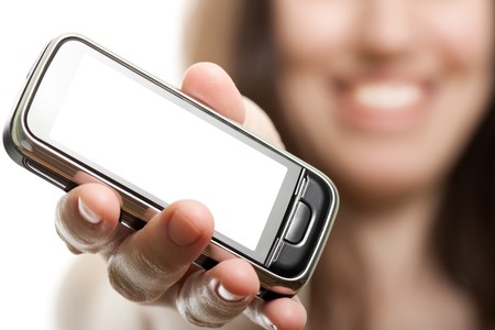 Smiling women holding mobile communication phoneの写真素材