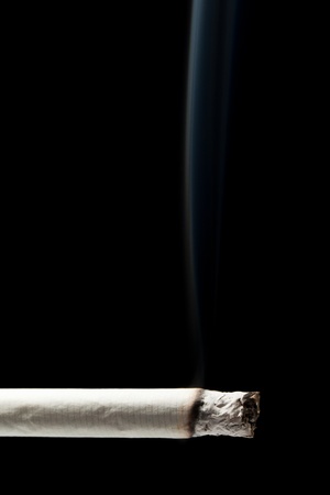 Addiction issue - smoking cigarette black isolatedの写真素材