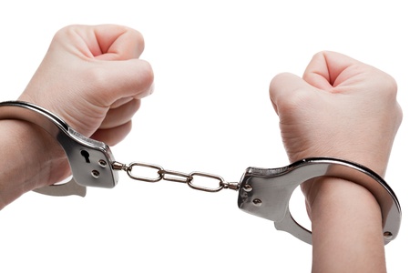 Police law steel handcuffs arrest crime human handの写真素材