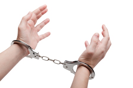 Police law steel handcuffs arrest crime human handの写真素材