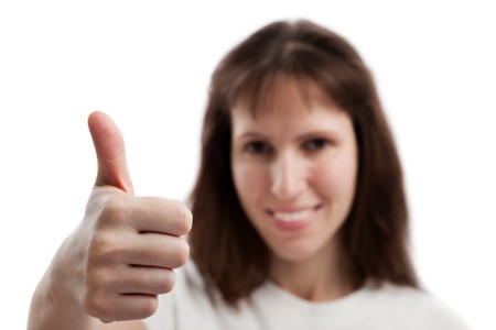 Human women hand gesturing thumb up success signの写真素材
