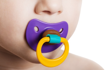Little child boy and plastic baby soother pacifierの写真素材