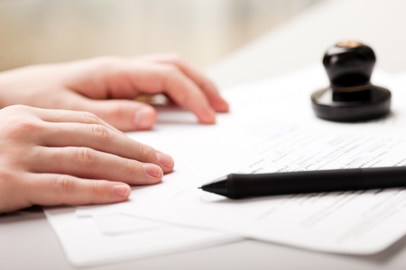 Human business men hand pen writing paper documentの写真素材