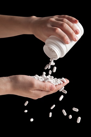 Human hand spill medicine healthcare vitamin pillの写真素材