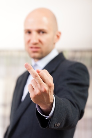 Human men hand gesture middle finger obscene signの写真素材
