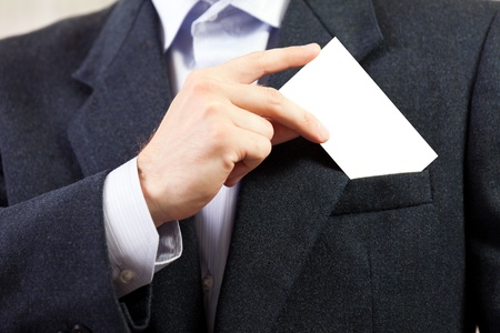 Business men hand holding white empty blank cardの写真素材