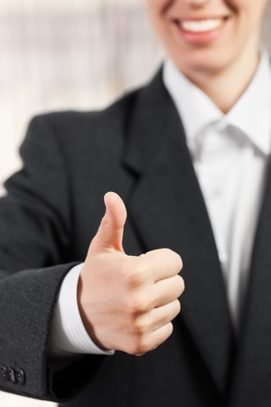 Business women hand gesture thumb up success signの写真素材