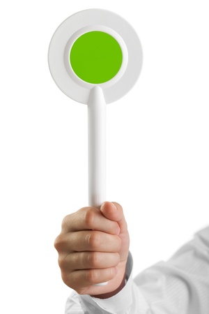 Human hand holding auction paddle voting card signの写真素材
