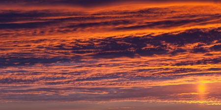 Beautiful nature - dramatic orange sunset on cloud skyの写真素材