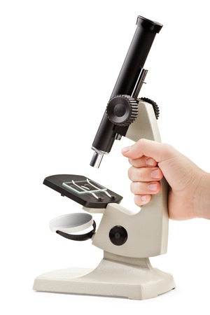 Human hand holding science laboratory or medical research microscope equipment white isolatedの写真素材