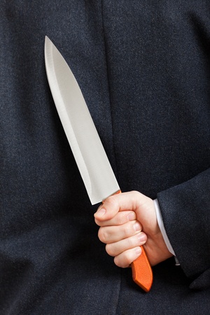 Murderer human hand holding sharp steel kitchen knife weaponの写真素材