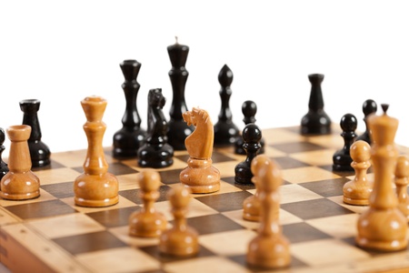 Strategy and competition chess game figures on wood boardの写真素材