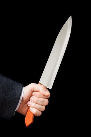 Murderer business man hand holding sharp steel kitchen knife weaponの写真素材