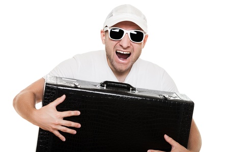 Cool smiling man in sunglasses hand holding large travel luggage suitcase white isolatedの写真素材