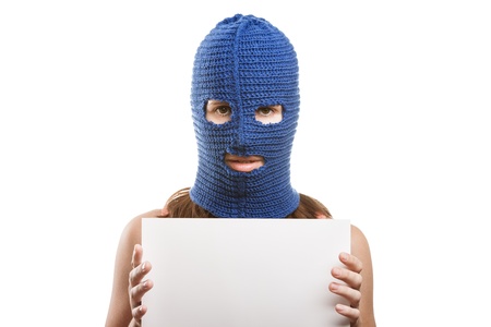 Russian protest movement concept - woman wearing balaclava or mask on head holding blank white card in hands white isolatedの写真素材