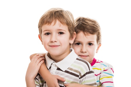 Family happiness - two little smiling child boy brothers white isolatedの写真素材