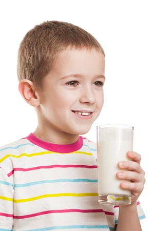 Beauty smiling child boy hand holding milk drink glass white isolatedの写真素材