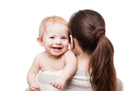 Loving mother hand holding little cute smiling newborn baby child white isolatedの写真素材