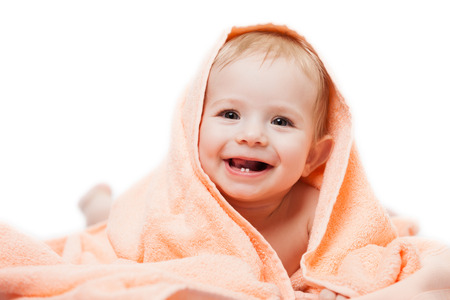 Little cute newborn baby child first milk or temporary teeth smiling face white isolatedの写真素材