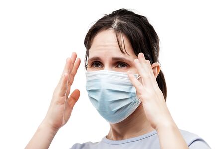 Human population virus, infection, flu disease prevention and industrial exhaust emissions protection concept - beauty woman wearing respiratory protective medical mask suffers headache white isolatedの写真素材