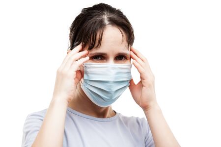 Human population virus, infection, flu disease prevention and industrial exhaust emissions protection concept - beauty woman wearing respiratory protective medical mask suffers headache white isolatedの写真素材