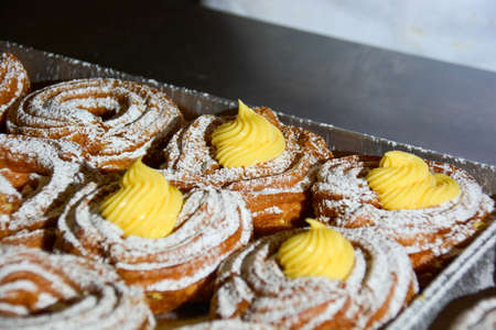 typical Italian dessert for Father's Day and St. Joseph's Day: zeppola filling the cream