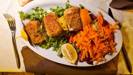 Italian skewer of swordfish rolls with julienned carrotsの写真素材