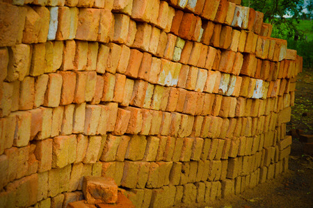 asymmetrical brick in a green forest siteの写真素材