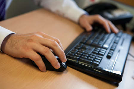 businessman with hands on keyboard