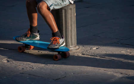feet of man on skateboard
