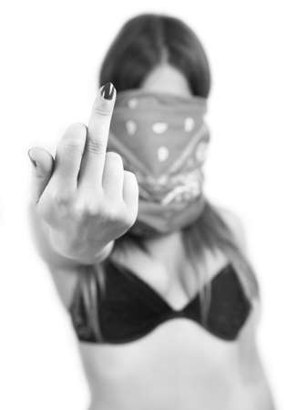rebel woman with a mask doing fuck you signの写真素材