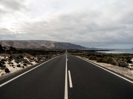 long lonely road on the beachの写真素材