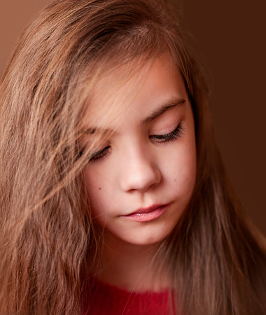 close-up portrait of a girl with long hairの写真素材