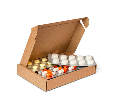 cardboard box with pills isolated on white background close-upの写真素材