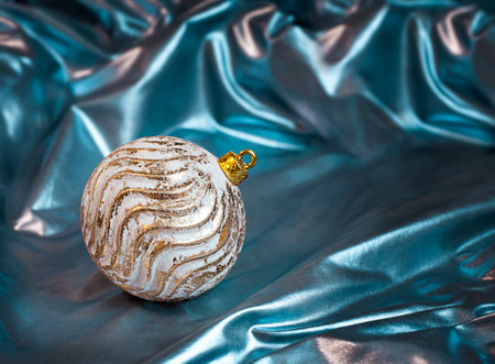 christmas ball on blue satin background with copy spaceの写真素材