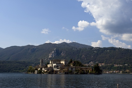 Picturesque views of the Lake Orta Island in summer with cloudy sky