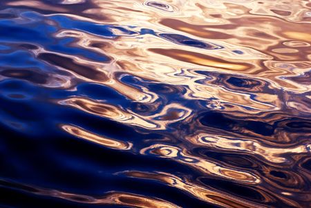 sunset and surface of atlantic oceanの写真素材