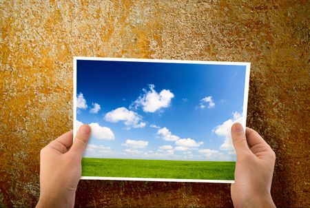 paper in hands and wallの写真素材