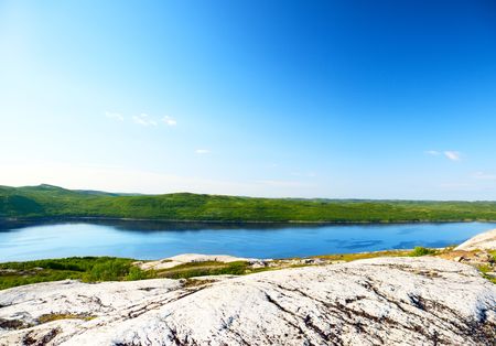 granite rock and mountains of Kola bay in north of Russianの写真素材